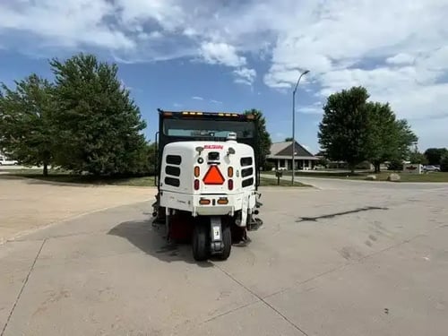Rear view of a 2018 Elgin Pelican NP street sweeper with safety markings